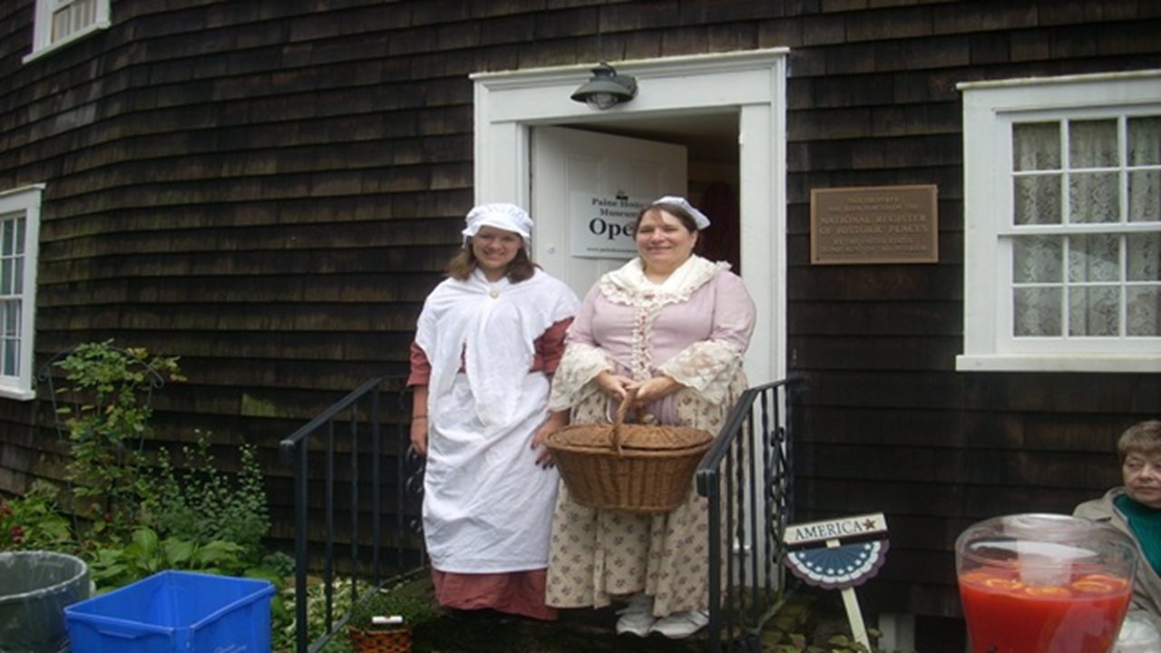 Historical interpreters outside the Paine House Museum